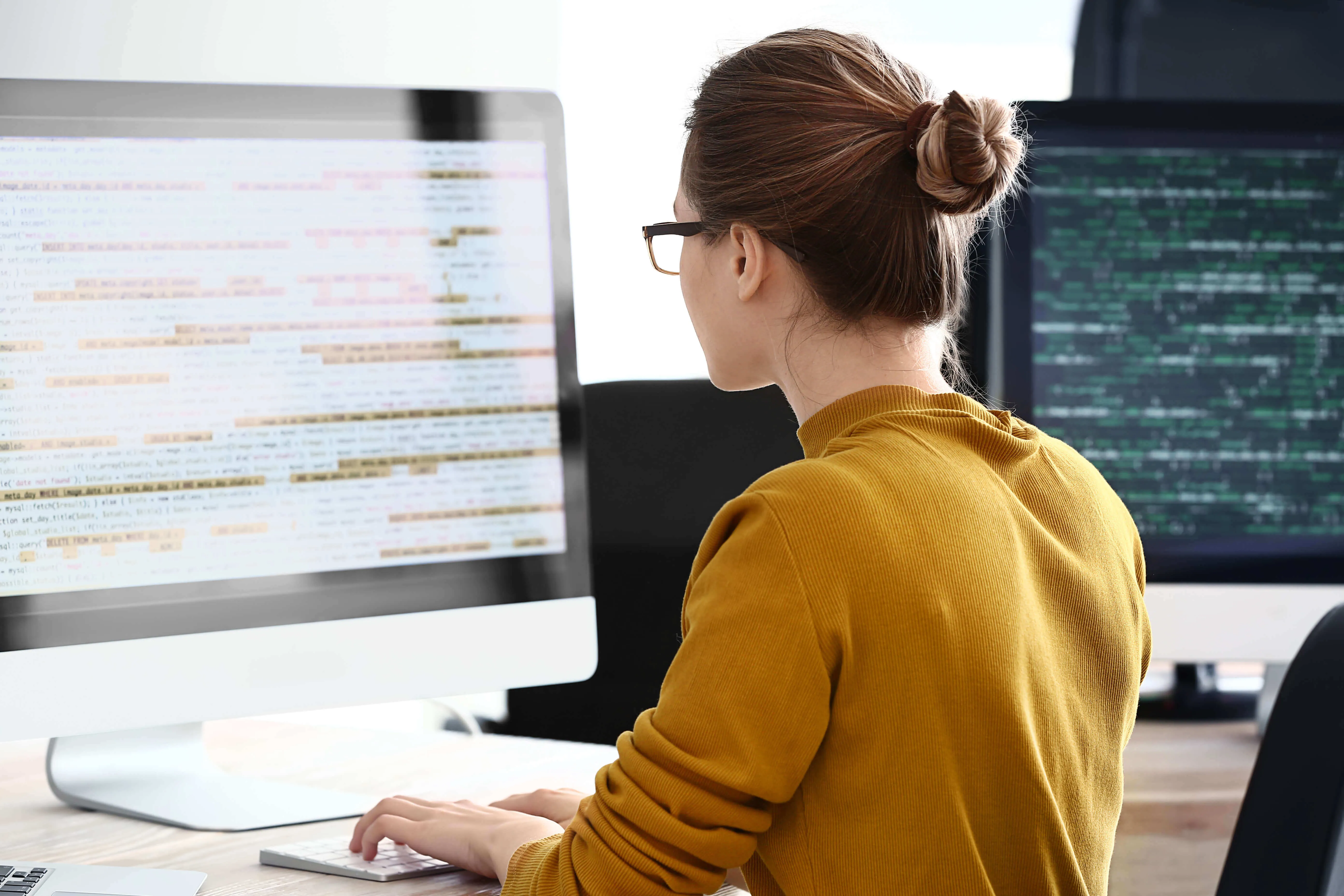 Woman coding on computer